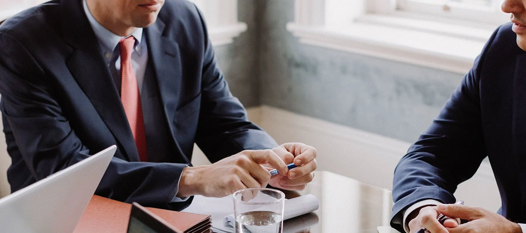 Two advisers going through a client's accounts